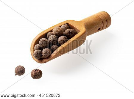 Allspice Jamaica Pepper In A Small Wooden Scoop Cutout. Wooden Spice Shovel Full Of Dried Pimento Be