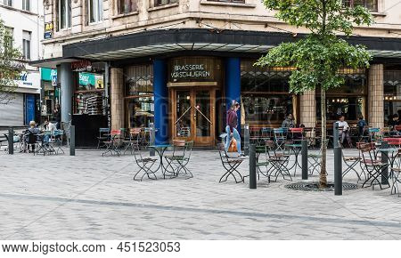 Saint Gilles, Brussels- Belgium - 07 08 2019 Facade, Square, Terrace With People Drinking Outside Of