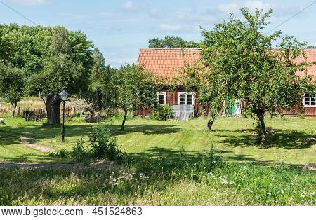 Ulva, Uppland - Sweden - 07 29 2019 Typical Red Wooden Swedish Summer Countryhouse And Garden