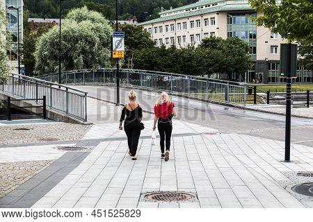 Sundsvall, Vastnorrland County - 08 02 2019: Two Young Blonde Girls Walking Towards The Bridge