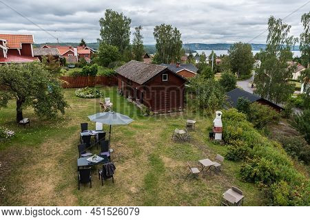 Segersta, Halsingland - Sweden - 08 04 2019: Panoramic View Over Old Village Houses With The Ljusnan