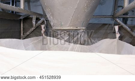 White Hard Grinded Plastic Comes Out Of The Cyclone Of The Machine By Pneumatic Transport Into The B