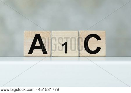 A1c Text On Wooden Cubes On A White Table Stand In Isolation. Medical Concept.