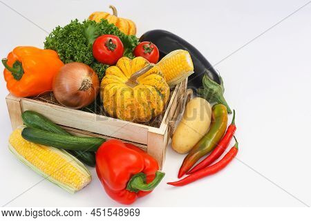 Fresh Vegetables In A Wooden Box On White Background