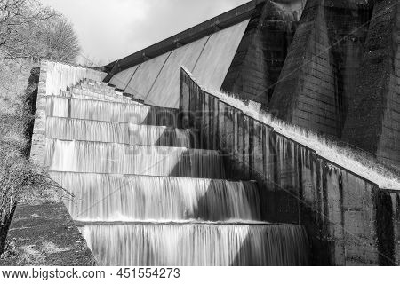Long Exposure Of The Waterfalls Flowing Over Wimbleball Dam In Somerset