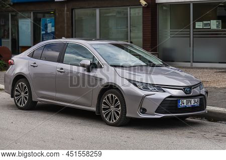 Side; Turkey - March 01 2022:   Silver   Toyota Corolla   Is Parked  On The Street On A Warm  Day Ag