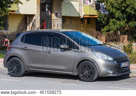Side; Turkey - March 03 2022:  Silver  Peugeot 208  Is Parked  On The Street On A Warm Summer Day Ag