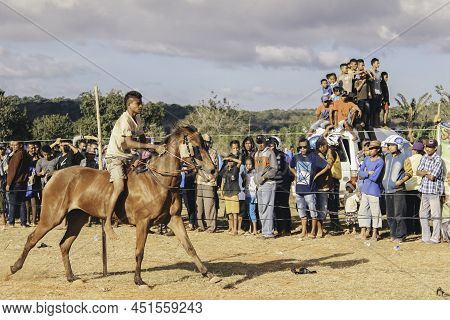 Young Man Jockeys In Horse Racers At Hus Traditional Horse Race Culture From Rote Island, East Nusa