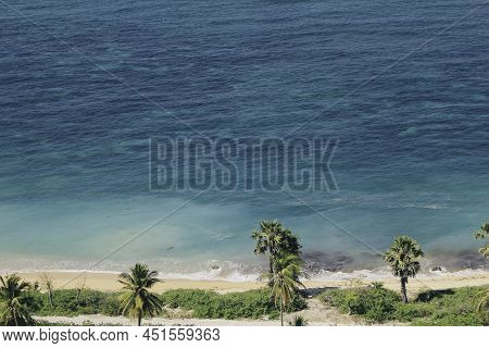 View Of Rote Tropical Beach With Deep Turquoise Blue Ocean And Small Exotic Island In The Center In