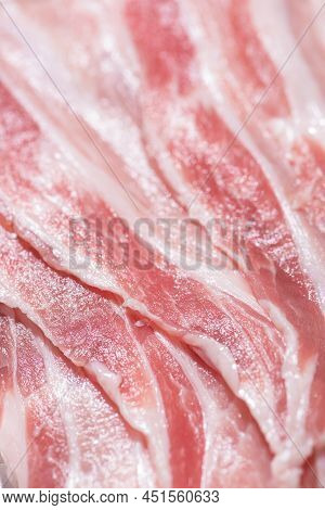 Close Up Top View Pack Bacon, Pieces Raw Meat Of Fresh Red Pork With White Fat Slices Are Sliced Int