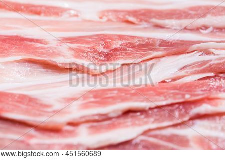 Close Up Top View Pack Bacon, Pieces Raw Meat Of Fresh Red Pork With White Fat Slices Are Sliced Int