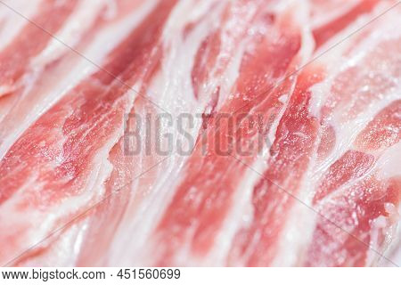 Close Up Top View Pack Bacon, Pieces Raw Meat Of Fresh Red Pork With White Fat Slices Are Sliced Int
