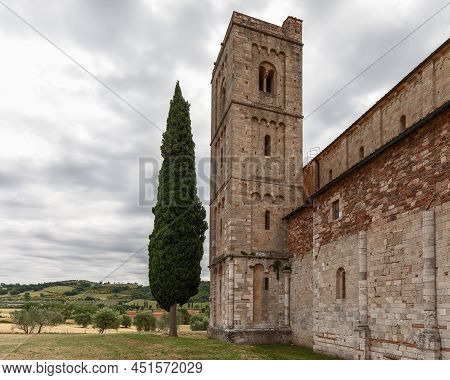 Tuscany - Italy. June 04, 2021: Union Of Ancient Architecture And Timeless Nature At The Abbey Sant 