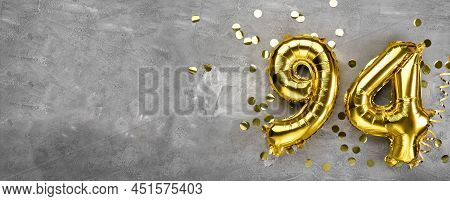 Yellow Foil Balloon Number, Number Ninety-four On A Concrete Background. Greeting Card With The Insc
