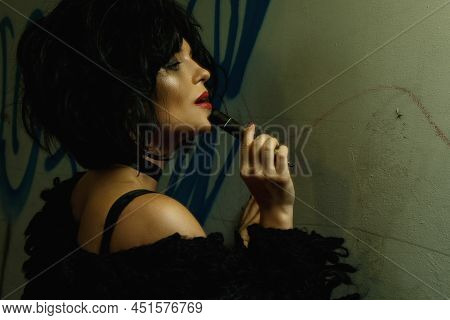 Freaky Woman In Dark Tunnel With Graffiti