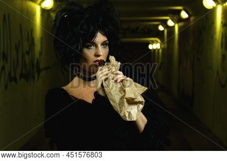 Freaky Woman With A Bottle Of Alcohol In The Paper Bag