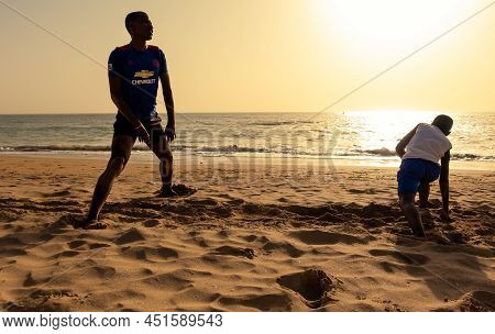 Saly, Mbour, Senegal - Circa December 2021. Unidentified Mature Man And Teenager, Father And Son, Do