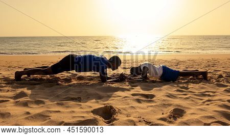 Saly, Mbour, Senegal - Circa December 2021. Unidentified Mature Man And Teenager, Father And Son, Do