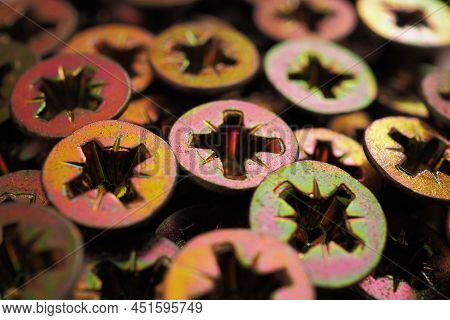 Anodized Screw Caps Close-up. A Vivid Illustration On The Theme Of Hardware And Fasteners. Materials
