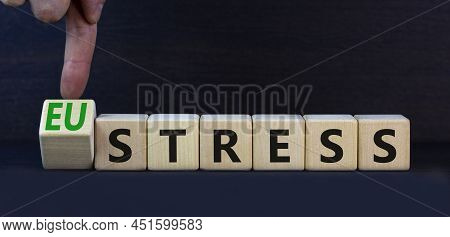 Eustress Or Stress Symbol. Turned The Wooden Cube And Changed The Concept Word Eustress To Stress. B