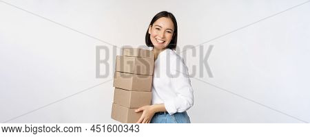 Portrait Of Young Asian Woman Holding Boxes, Carry Delivery Goods. Korean Female Entrepreneur Assemb