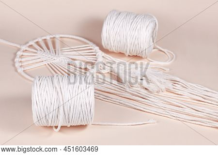 Cream White Cotton Macrame Cord Used For Diy Decoration Object On Beige Background