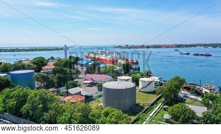 Red And White Floating Storage And Regasification Unit, Fsru, Lng-vessel In Benoa Harbour Under Ligh
