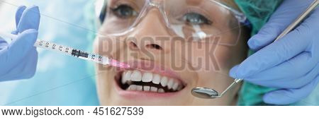 A Woman Is Given An Injection Before A Dental Procedure, A Face Close-up. Modern Painless Dental Tre