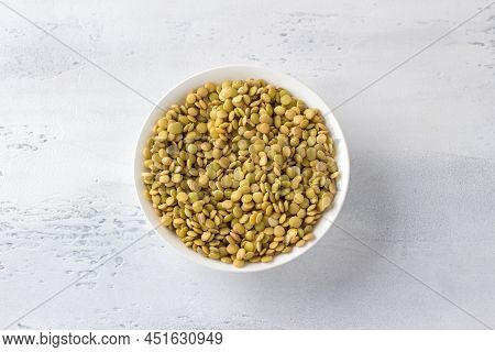 Raw Soaked Lentils In A White Bowl On A Light Gray Background, Top View. Healthy Food Concept