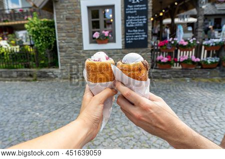 Spooned Ice Cream Filled Chimney Cake, Traditional Sweet Dessert In Middle Europe Kurtoskalacs Trdel