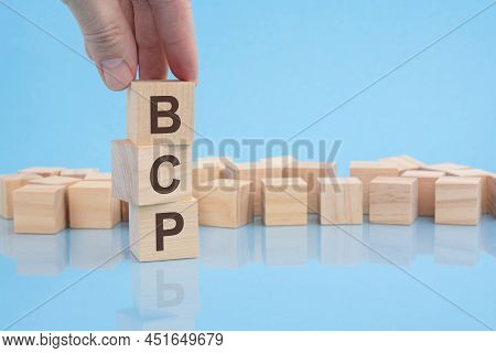Hand Putting Wood Cube Block Increasing On Top With Letter B Upward Direction. Bcp Text. Financial, 