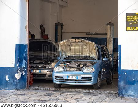 Brindisi, Italy - October 28, 2021: Blue Fiat Seicento With Open Hood In A Small Service Garage To B