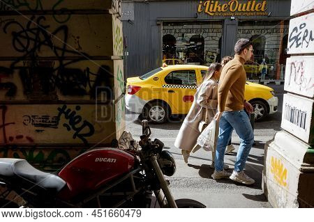 Bucharest, Romania - March 22, 2022: People Seen Walking In Front Of The Architectural Arches Of A B