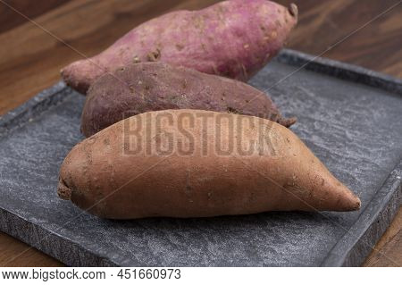Colorful Root Vegetables Pink, Purple And Orange Organic Sweet Potatos