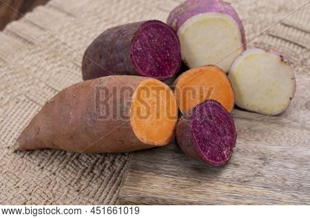 Colorful Root Vegetables Pink, Purple And Orange Organic Sweet Potatos