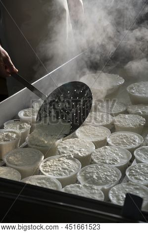 Process Of Making Fresh White Soft Ricotta Whey Cheese On Small Cheese Farm In Parma, Italy