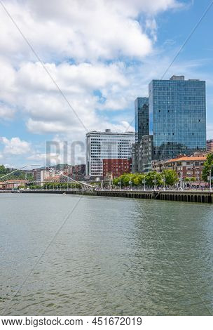 Bilbao, Spain - June 14, 2018:  View Of  The City On The Nervion River With The Zubizuri Bridge In T