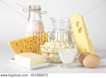 Dairy Products, Milk, Yogurt, Sour Cream, Assorted Cheese, Cottage Cheese, Butter And Eggs On White 