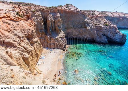 Idyllic Tsigrado beach surrounded by beautiful cliffs on Greek island of Milos