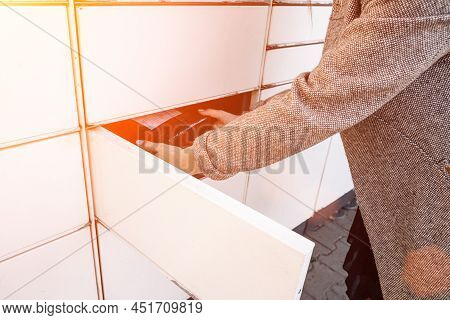 Postal Terminal. Post Delivery Automat Service And Hands With Parcel Courier Box. Mail Delivery And 