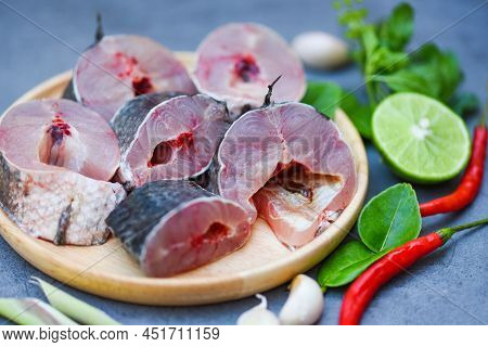 Snakehead Fish For Cooking Food, Striped Snakehead Fish Chopped With Ingredients Lemon On Wooden Pla