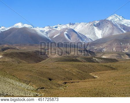 Scenic Landscape In Atacama Desert With Snow Covered Mountains