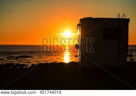 Scenic Sunset And Oceanfront Rv Camping. Class C Recreational Vehicle With Ocean Vista. Camping Them