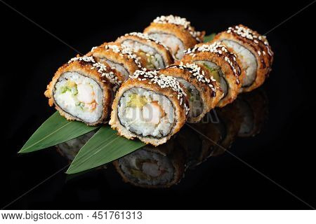 Traditional Delicious Fresh Sushi Roll Set On A Black Background With Reflection. Sushi Roll With Ri