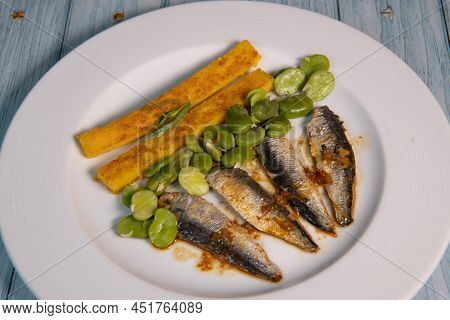 Recipe Of Sardine Fillets Marinated With Chili, Polenta With Beans, Seefood. High Quality Photo