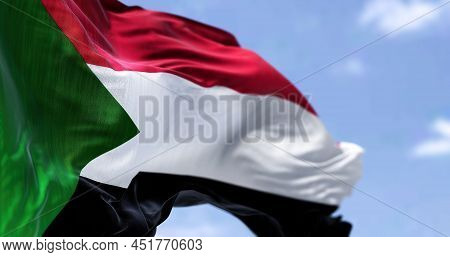 Detail Of The National Flag Of Sudan Waving In The Wind On A Clear Day. Sudan Is A Country In Northe