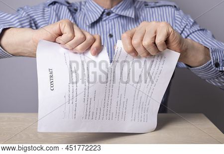Man Hands Closeup Breaking Contract. Termination Of Agreement Or Employee Dismissal Concept. Man Sit