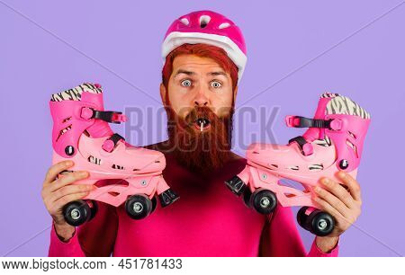 Surprised Bearded Man In Sport Helmet With Roller Skates. Healthy Lifestyle. Roller Skating Ride.