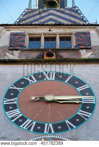 Zug, Switzerland - December 31, 2021: A Tower In Canton Zug With Medieval Clock And Windows Above