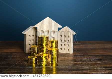 Residential Buildings And Coins Stacks. Business And Real Estate. Rental Income. Capitalization And 